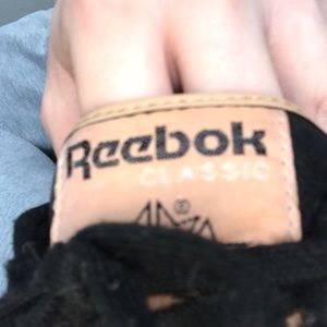 Black leather Reebok Classic with gum sole.